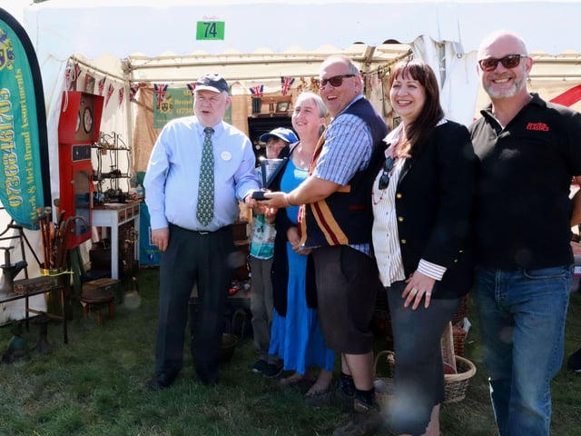 Mark & Mel's Broad Assortments receiving the Best Stand Award