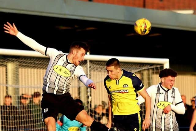 Luke Hallett, centre, pulled a goal back for Gosport Borough at Wimborne. Picture: Tom Phillips