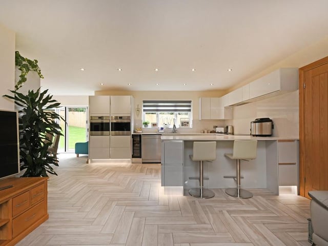 This large, light and airy space has plenty of room for the whole family to enjoy and has bi-fold doors that lead onto the rear patio and lawned garden.