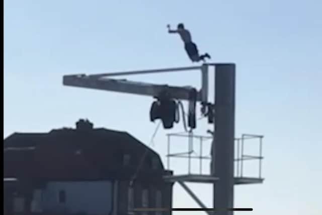A child is spotted leaping from a crane in The Camber, Old Portsmouth.