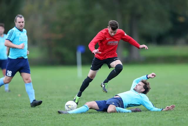 Jamie Peters, pictured making a sliding tackle, has been among the outfield players used in goal by Portchester Rovers this season.
Picture: Chris Moorhouse
