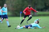 Jamie Peters, pictured making a sliding tackle, has been among the outfield players used in goal by Portchester Rovers this season.
Picture: Chris Moorhouse