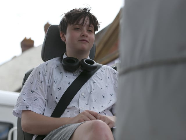 Jay Hope, 15, on the seatbelt simulator which simulates a 5 mph car crash.Picture: Chris  Moorhouse (220624-07)