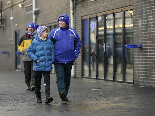 The calm before the storm at Fratton Park as these fans make their way to their seats.