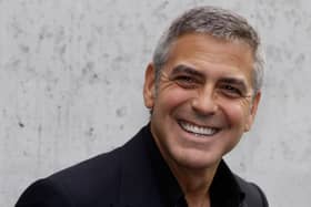 George Clooney.

MILAN, ITALY - SEPTEMBER 27:  George Clooney attend the Giorgio Armani Spring/Summer 2011 fashion show during Milan Fashion Week Womenswear on September 27, 2010 in Milan, Italy.  (Photo by Vittorio Zunino Celotto/Getty Images)