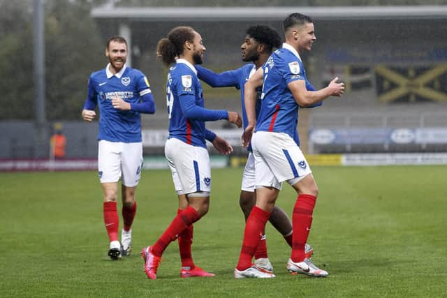 Ellis Harrison congratulates Marcus Harness on his hat-trick during Pompey's return to scoring ways at Burton last weekend. Picture: Daniel Chesterton/phcimages.com