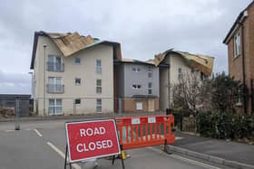 The road outside the block of flats has been cordoned off due to the damage. Picture: Emily Turner