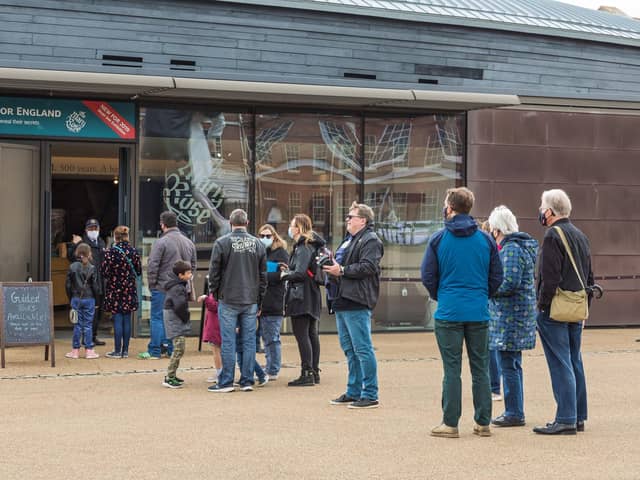 Queues form outside the Mary Rose Museum. Picture: Mike Cooter (220521)