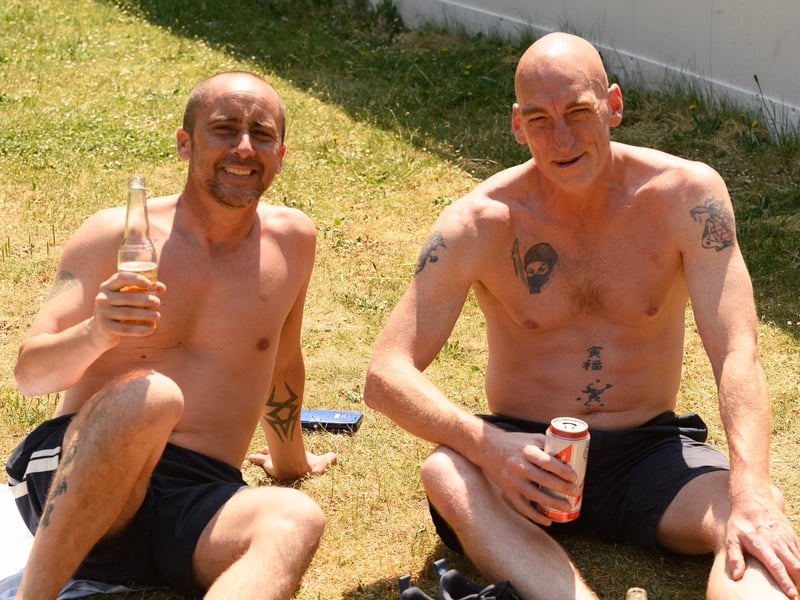 Two music lovers enjoying a beer at Victoria Park.