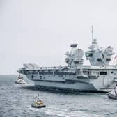 HMS Queen Elizabeth departs from Portsmouth after ship's crew is tested for Covid-19 on Wednesday 29 April 2020. Pictured: HMS Queen Elizabeth passes the Round Tower, Old Portsmouth. Picture: Habibur Rahman