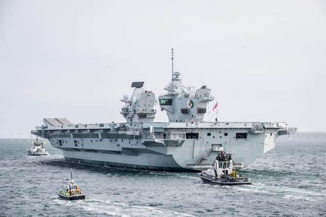 HMS Queen Elizabeth departs from Portsmouth after ship's crew is tested for Covid-19 on Wednesday 29 April 2020. Pictured: HMS Queen Elizabeth passes the Round Tower, Old Portsmouth. Picture: Habibur Rahman