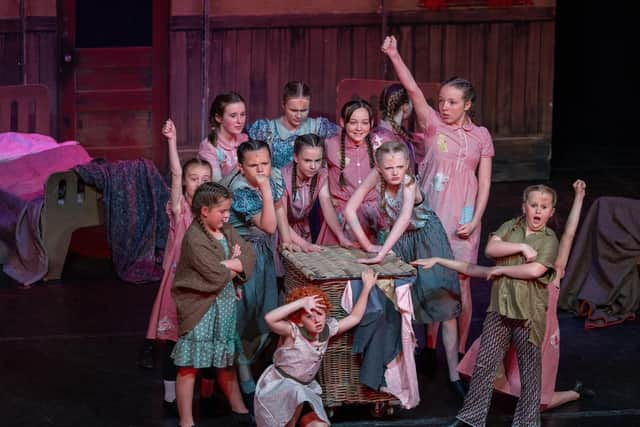 A scene from Annie Jr by Performers Theatre Company as they announce auditions for their next production - Matilda Jr