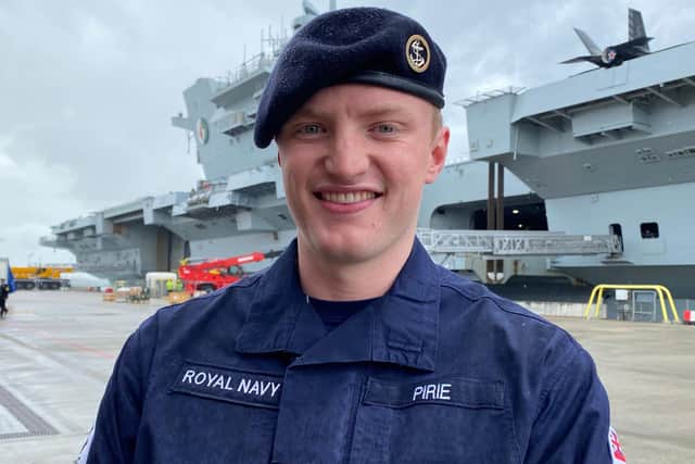 AB Bart Pirie, 23, of Waterlooville, is among those serving on board HMS Queen Elizabeth during her deployment. Here he is pictured in front of the ship as it prepared to leave Portsmouth on Saturday, May 22. Photo: Tom Cotterill