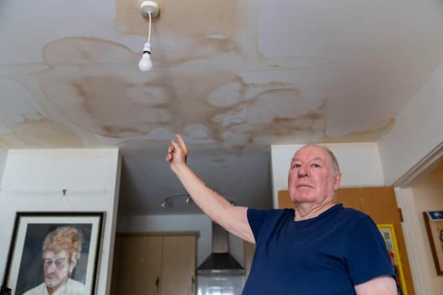 Adrian Weston inside his living room, showing the ceiling damage, in Emsworth. Picture: Andy Hornby