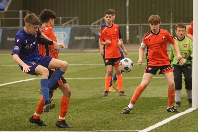 Action from the Portsmouth Youth League Stuart Madigan Cup final between Baffins Milton Rovers Vipers U14s (all blue kit) and AFC Portchester Vikings U14s (orange and black kit). Picture: Keith Woodland (190321-289)