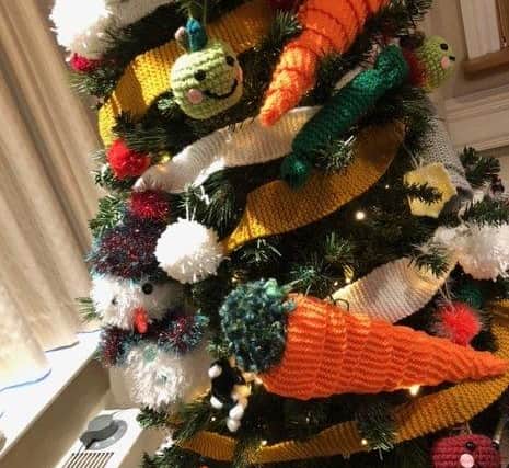 Decorations on the yarn-bomed Christmas tree.