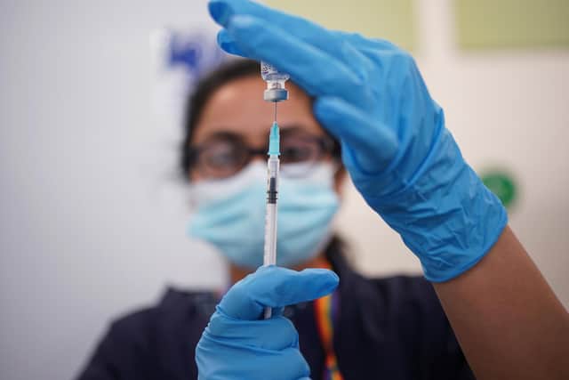 A nurse prepares a dose of the Pfizer Covid-19 vaccination