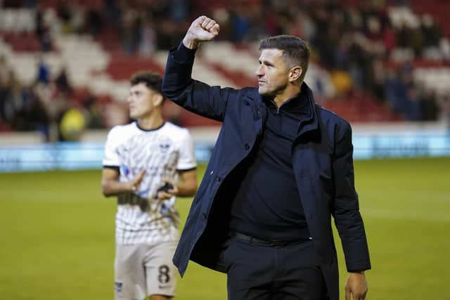 John Mousinho salutes Pompey fans at Barnsley. Pic: Jason Brown