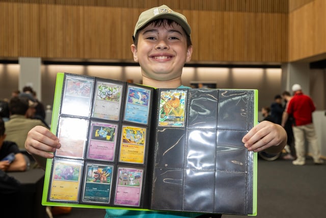 Issac, 9, from Portsmouth, proudly displays his Pokemon cards.  Photos by Alex Shute