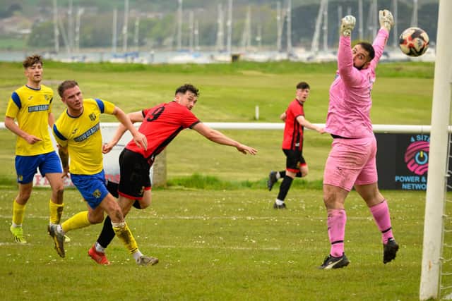 Dale Mason heads Fleetlands' second goal against New Milton. Picture: Keith Woodland