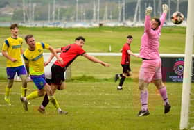 Dale Mason heads Fleetlands' second goal against New Milton. Picture: Keith Woodland