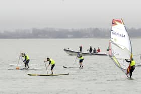 Paddleboarders and windsurfers off Hayling Island seafront. Picture by Malcolm Wells