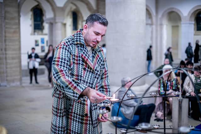 CP, vice chair of Portsmouth Pride, lights a candle in memory of Brianna Ghey
Picture: Habibur Rahman