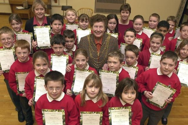 Estfield Primary School pupils in December of 2001. Accepting certificates for their involvement with planting trees.
