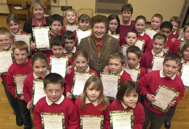 Estfield Primary School pupils in December of 2001. Accepting certificates for their involvement with planting trees.
