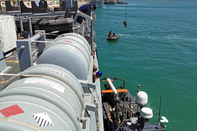 The autonomous craft sailing alongside HMS Bangor. Pictured is AB (D) Oakley, MHU Team, L (D) Smith, AB (MW) Rowan-Thompson. Picture: SLt Harris RN/UK MOD Crown copyright.