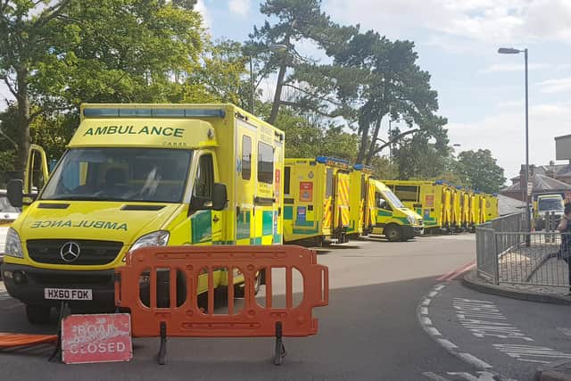 Ambulances parked outside the emergency department entrance at QA Hospital, Portsmouth in 2019