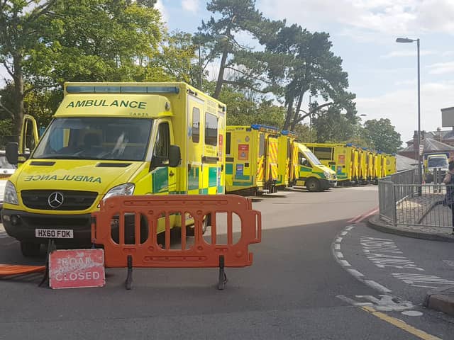 Ambulances parked outside the emergency department entrance at QA Hospital, Portsmouth in 2019