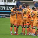 Hugs all round - Hawks players celebrate an FA Cup goal at Bath City earlier this season. Pic: Kieron Louloudis