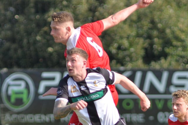 Horndean defender Chad Field rises the highest. Picture by Martyn White