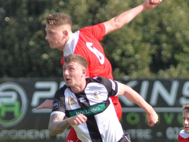 Horndean defender Chad Field rises the highest. Picture by Martyn White