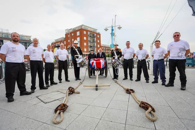At 4pm on Saturday afternoon, a Royal Navy Field Gun with a Union flag draped over carried the RNA memorial wreath from HMS Nelson Wardroom to the Falklands Memorial, Sally Port, Old Portsmouth, via Gunwharf Quays. Pictured - The team from Field Gun Sport, led by Danny Tregarthen with Bill Oliphant, General Secretary of the Royal Naval Association and WO1 Claire Robson (Centre). Photos by Alex Shute