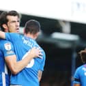 John Marquis celebrates scoring Pompey's winner.