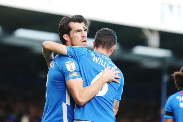John Marquis celebrates scoring Pompey's winner.