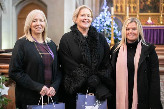 Comfort and Joy Cash Handout at St Marys Church, Fratton, Portsmouth on Friday 16th December 2022
Pictured: Mel Goddard from The Roberts Centre, Claire Lambon from Stop Domestic Abuse and Claire Haque 
Picture: Habibur Rahman
