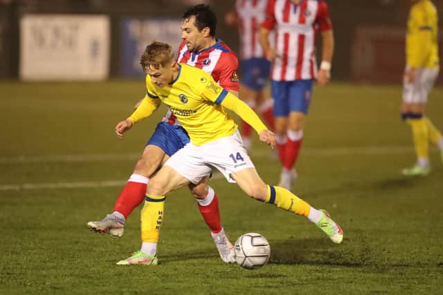 Hawks left back Joe Newton in action  at Dorking. Picture: Dave Haines.