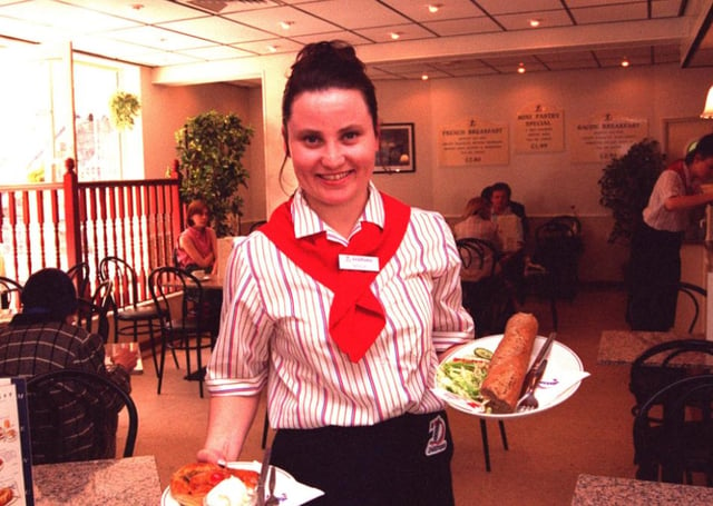 Waitress Natalie serves baguettes in the DeliFrance Cafe in Chapel Walk in 1996