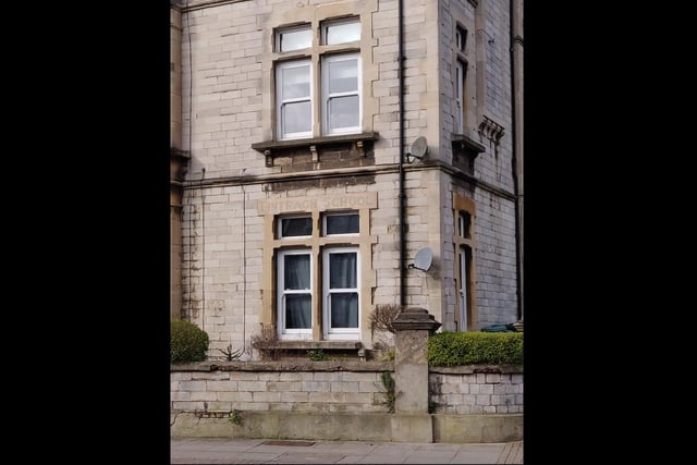 A faded sign for Fintragh School in Victoria Road South, near the Hereford Road junction.
