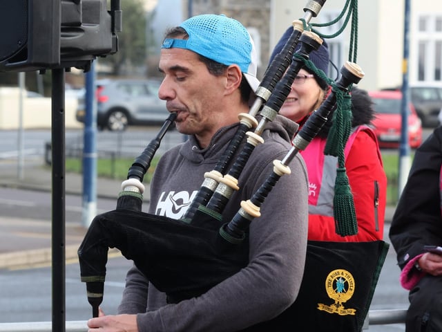 Piper Dan plays before the start of the New Year's Day parkun in Southsea. Photograph by Sam Stephenson