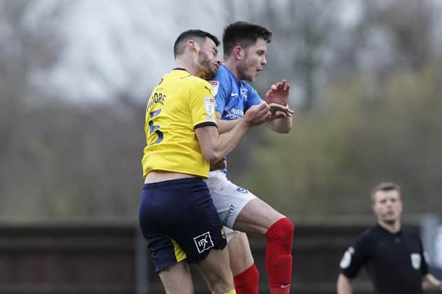 George Hirst was shown a yellow card for his challenge on Elliott Moore. Picture: Jason Brown