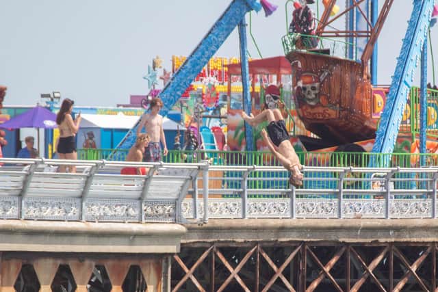 People jumping into the water from South Parade Pier in Southsea. 

Picture: Habibur Rahman