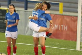 Abi Mason jumps on goalscorer Jazz Younger after she netted her first of two goals against AFC Portchester Ladies. Picture: Dave Haines