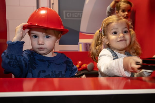 Cooper and Rio, both 2, enjoy the new fire station at Mini Town Role Play & Cafe. Photos by Alex Shute