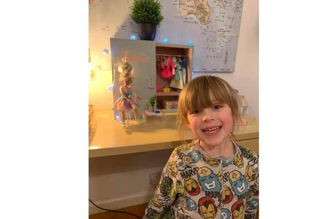 Four-year-old Alexa Prior and her homemade Barbie wardrobe.