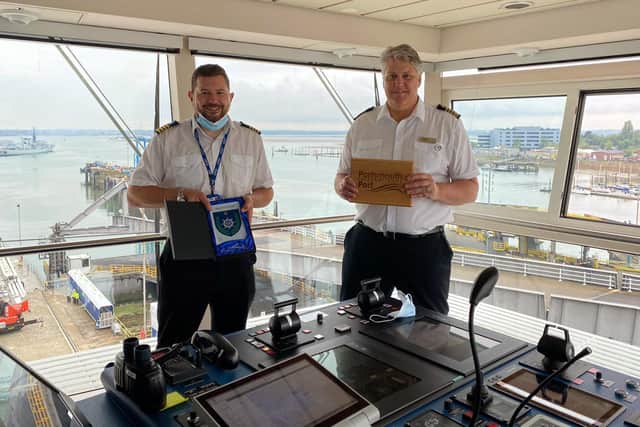 Spirit of Discovery in Portsmouth

Portsmouth International Ports harbour master, Ben McInnes, exchanging plaques with the captain of Spirit of Discovery Darin Bowland.
Picture: Portsmouth International Port/Andrew Sassoli-Walker