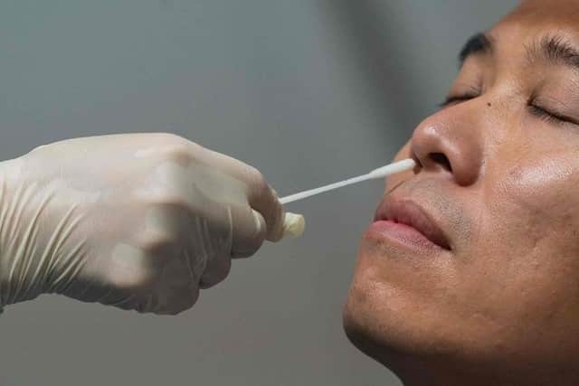 The government is expanding test trials that could do away with swab testing for Covid-19. Picture: ANTHONY KWAN/POOL/AFP via Getty Images